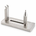 Stainless steel slingshot band tying jig front view — engraved 10cm rule on base